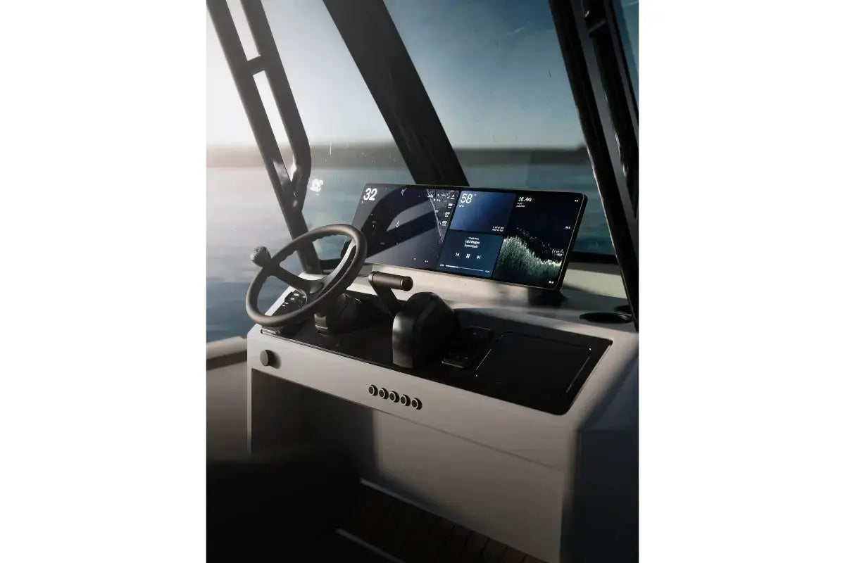 Arc Coast Electric Boat dashboard with steering wheel and digital displays on a clear day.