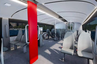 Candela P-12 Shuttle Electric Ferry Modern interior with gray seats, a red pole, and bicycle inside.