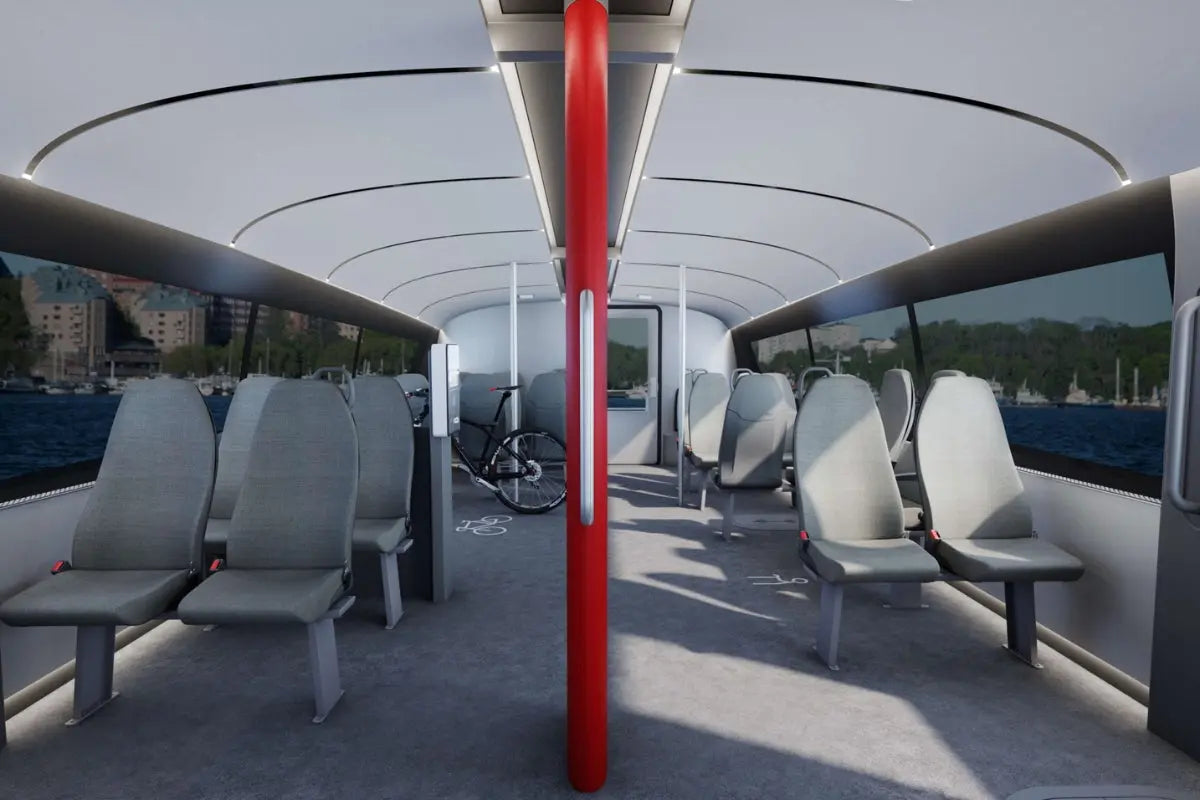 Candela P-12 Shuttle Electric Ferry Interior with gray seats and a red pole, showing a scenic view outside.