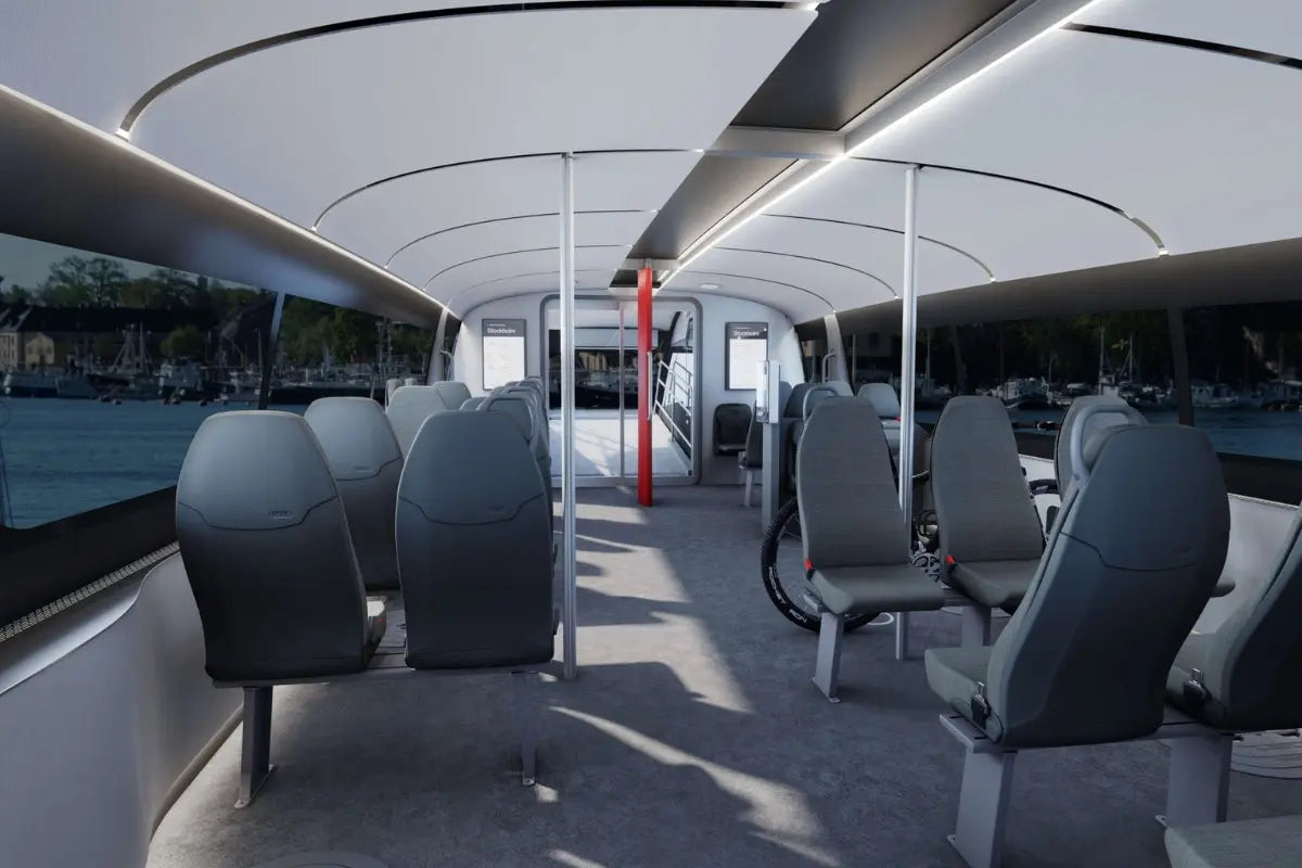 Candela P-12 Shuttle Electric Ferry Modern interior with gray seats and large windows.