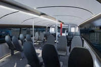Candela P-12 Shuttle Electric Ferry Interior with gray seats and large windows showing water and boats outside.