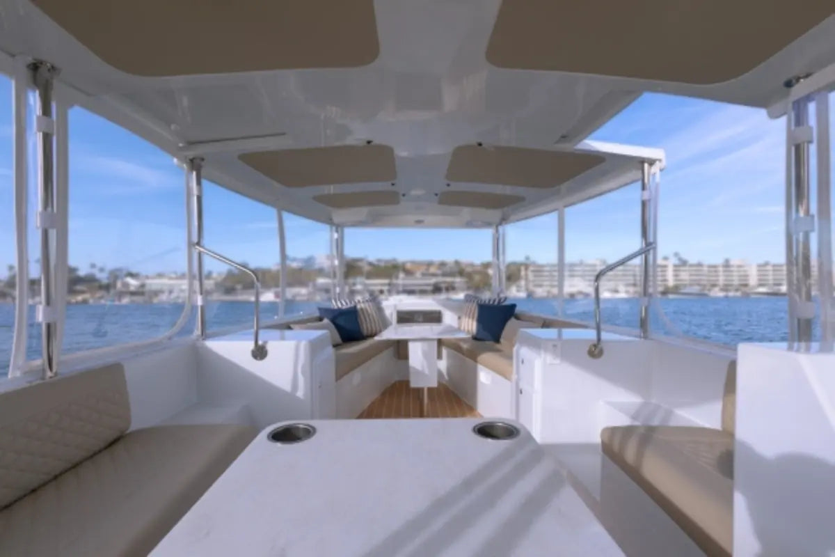 Duffy Balboa 20 Electric Boat Interior of a yacht with seating area and view of water and skyline