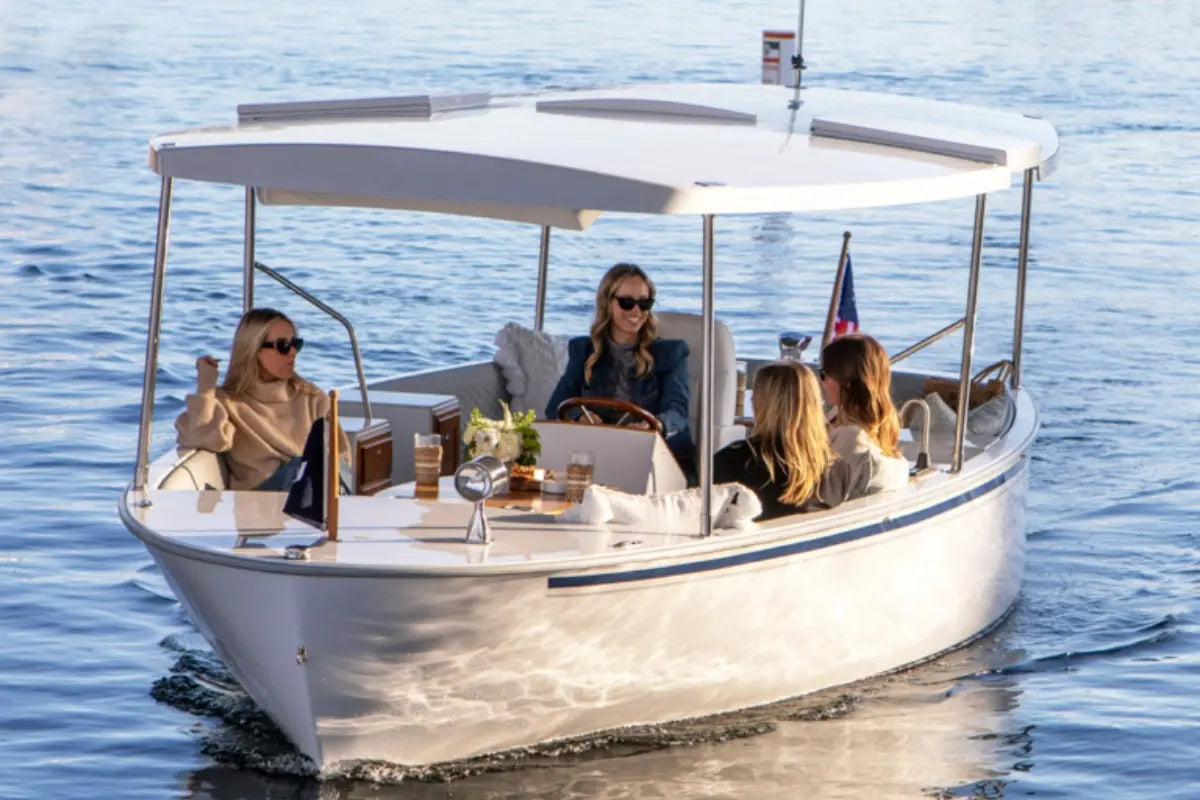 Group of people on a Duffy Balboa 20 Electric Boat in the water