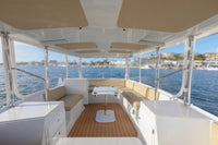 Duffy Balboa 20 Electric Boat Interior with seating area and table on a body of water