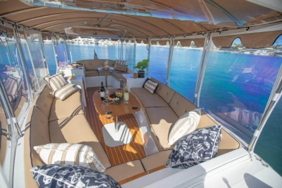 Interior of a luxurious Duffy Bay Island 22 Electric Boat with seating area and ocean view