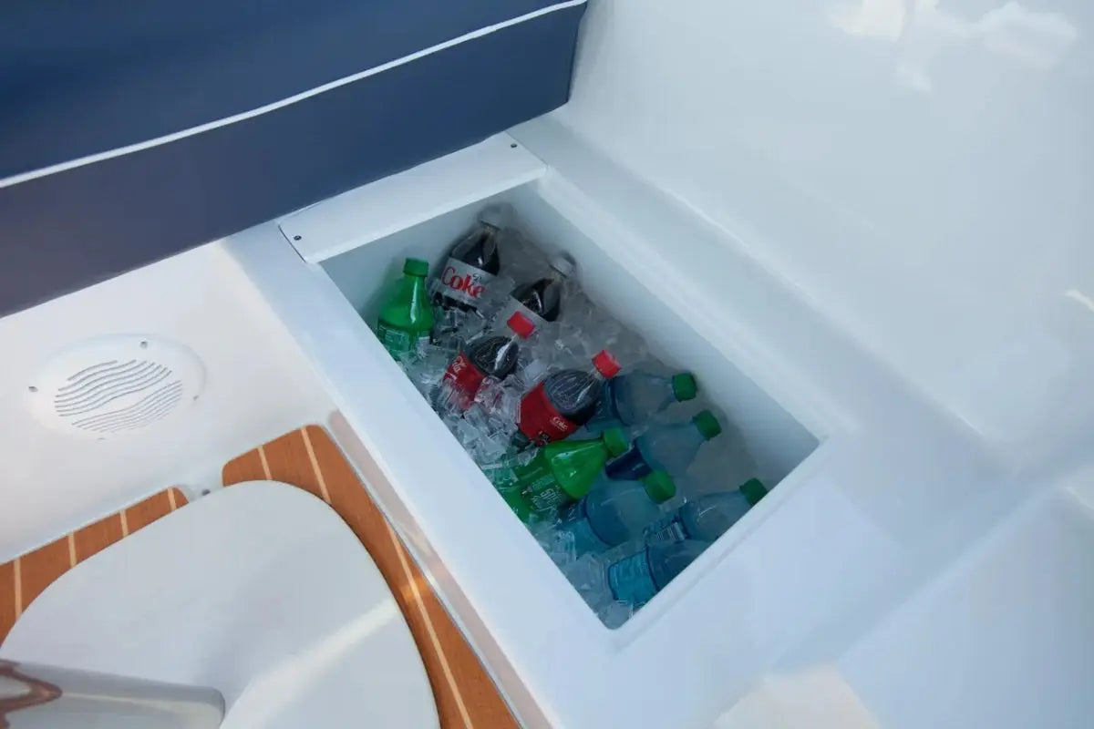 Duffy Snug Harbor 18 Electric Boat Open cooler with ice and bottles inside, showing a blue interior.