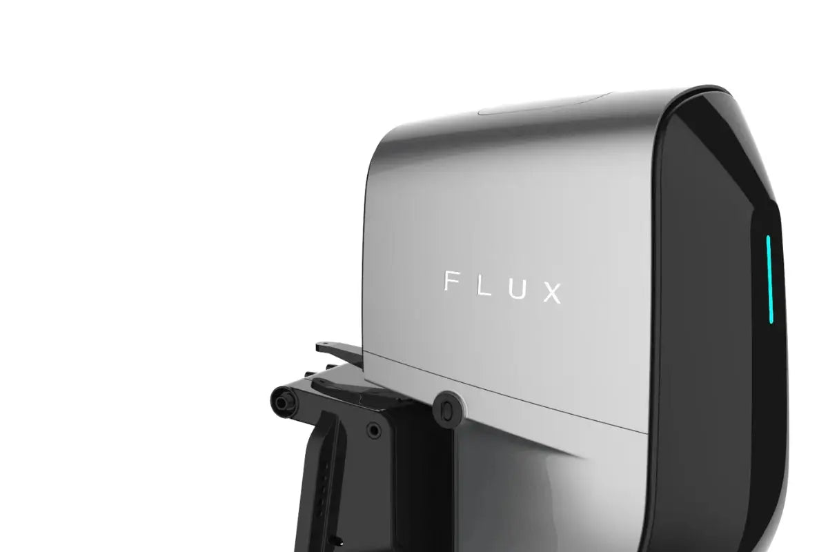 Silver and black device with 'FLUX' branding on a white background
