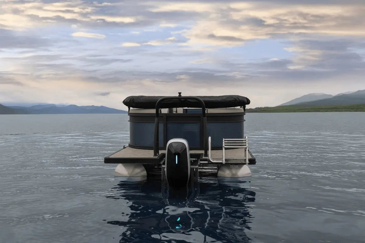 Flux Flagship Discover Electric Boat on a calm lake with mountains in the background