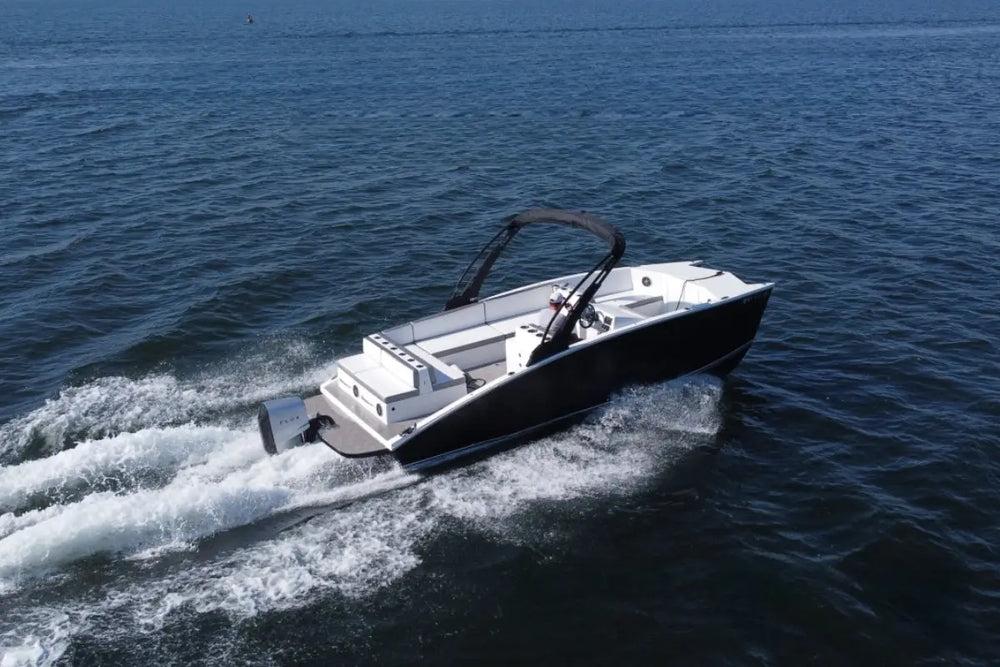 Flux GFX Stealth Electric Catamaran Boat speeding across a body of water