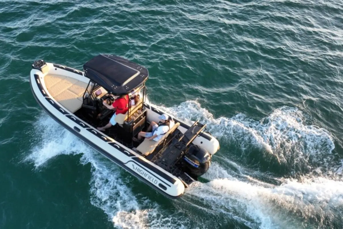 Inflatable Flux Highfield Sport 660 Electric Boat with people on a body of water