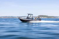 Rigid inflatable Flux Highfield Sport 660 Electric Boat on the water with people on board