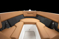 Tan leather seats inside Four Winns H2e Electric Boat with a black interior.
