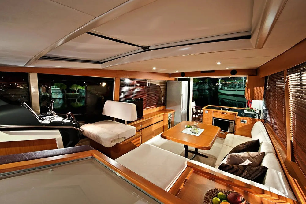 Luxury Greenline 40 Electric Yacht interior with seating area, table, and large windows.