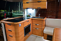 Wooden kitchen island with sink and oven in Greenline 40 Electric Yacht interior