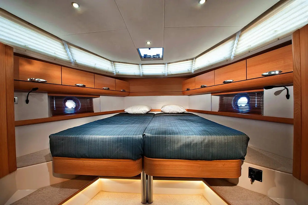 Greenline 40 Electric Yacht Nautical cabin with a bed and wooden paneling