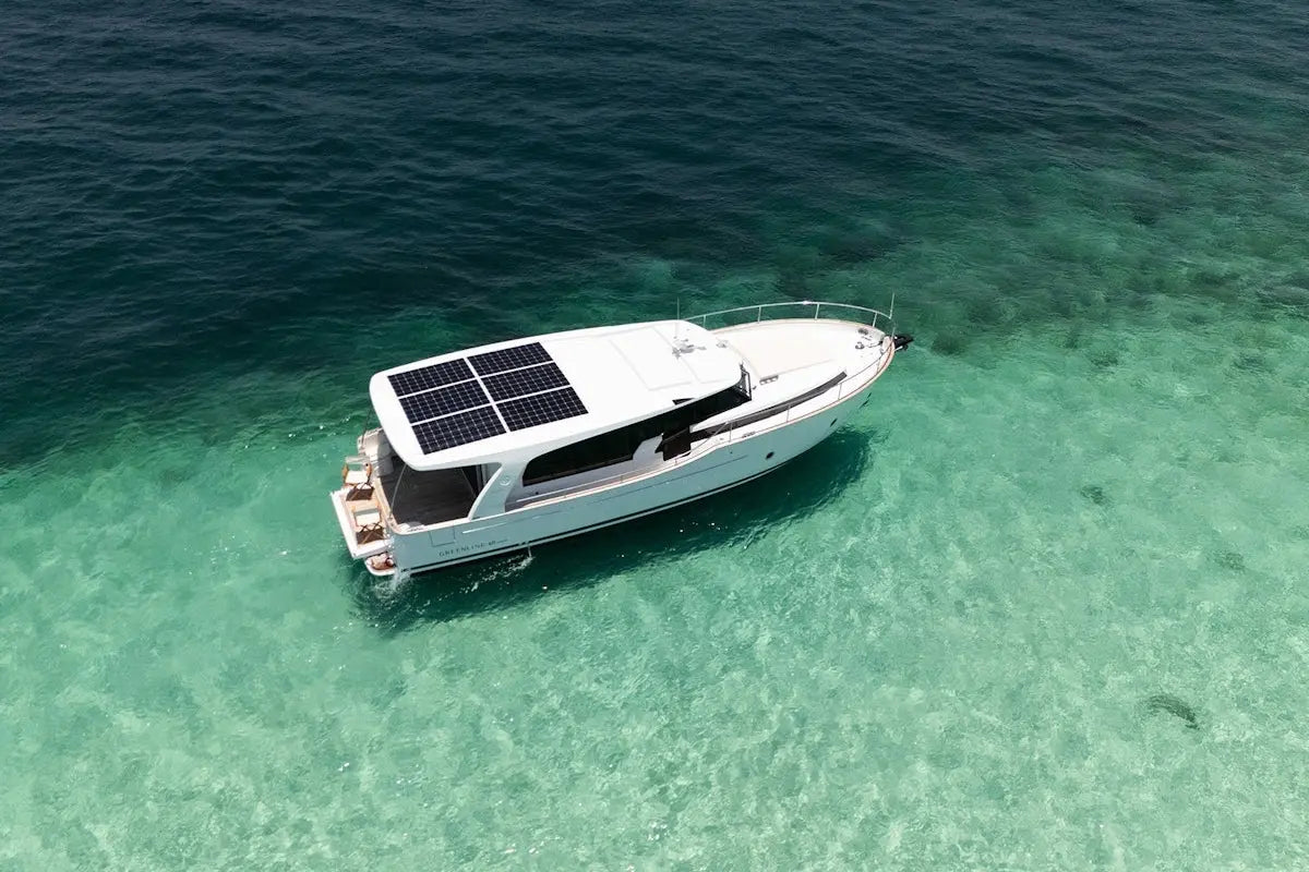 Greenline 40 Electric Yacht with solar panels on a clear turquoise sea
