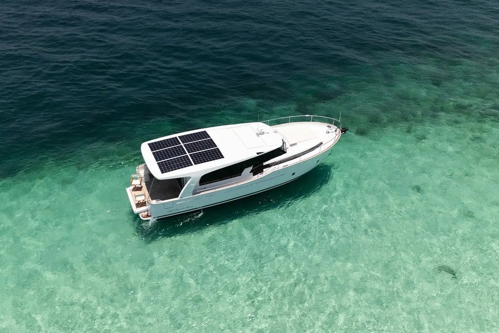 Greenline 40 Electric Yacht with solar panels on a clear turquoise sea