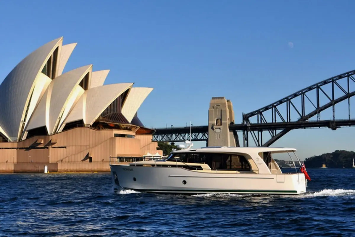 Greenline 40 Electric Yacht sailing in front of the Sydney Opera House and Harbour Bridge.