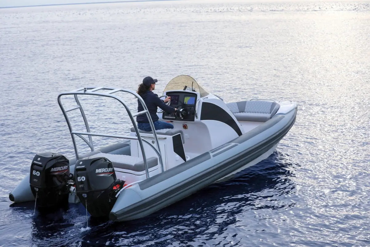 Person driving a Hyfoil 22 Electric Boat on calm water