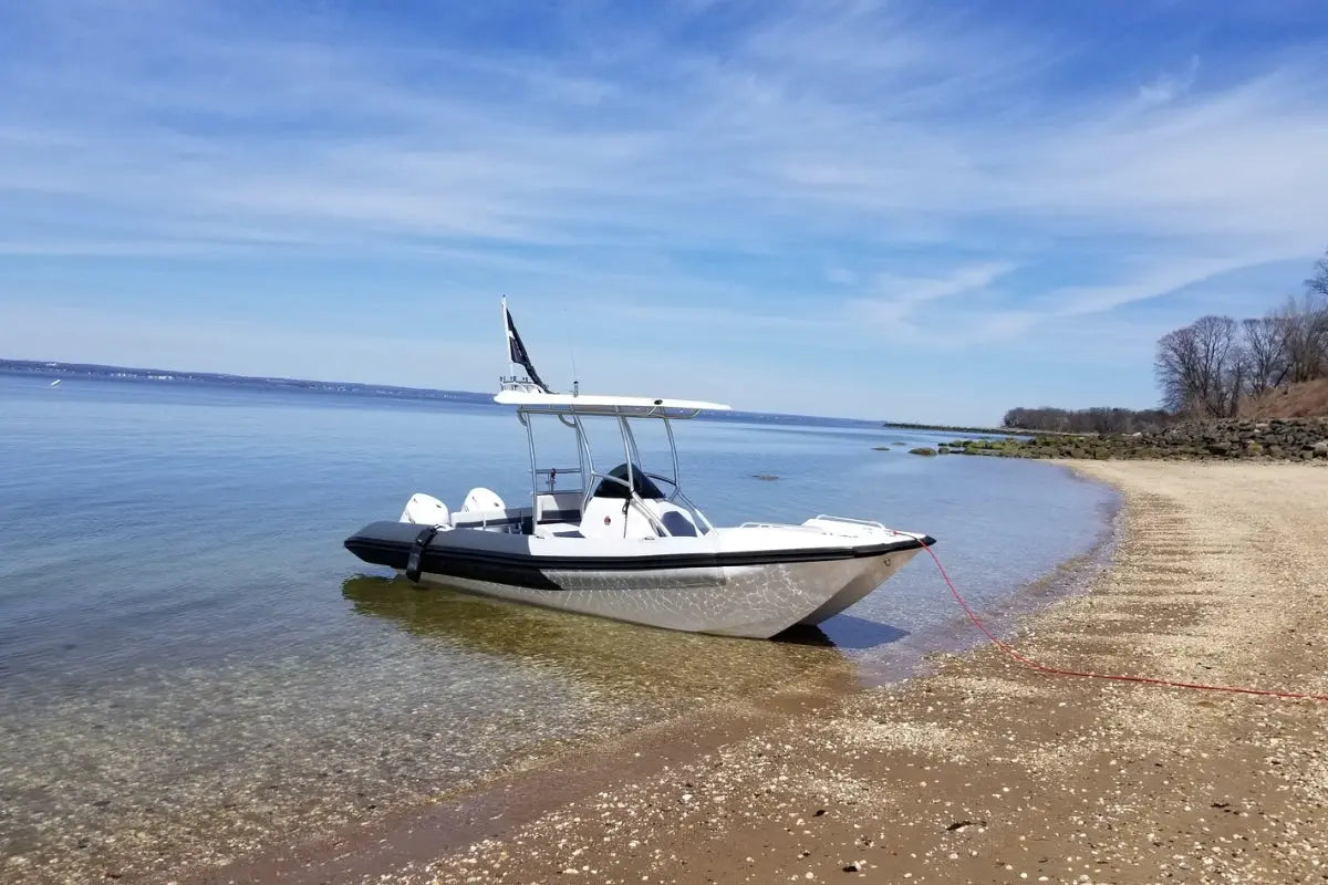 Hyfoil 22 Electric Boat on a sandy beach with clear water and blue sky