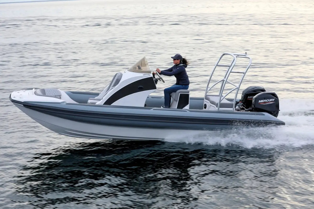Person driving Hyfoil 22 Electric Boat on water with Mercury outboard motor