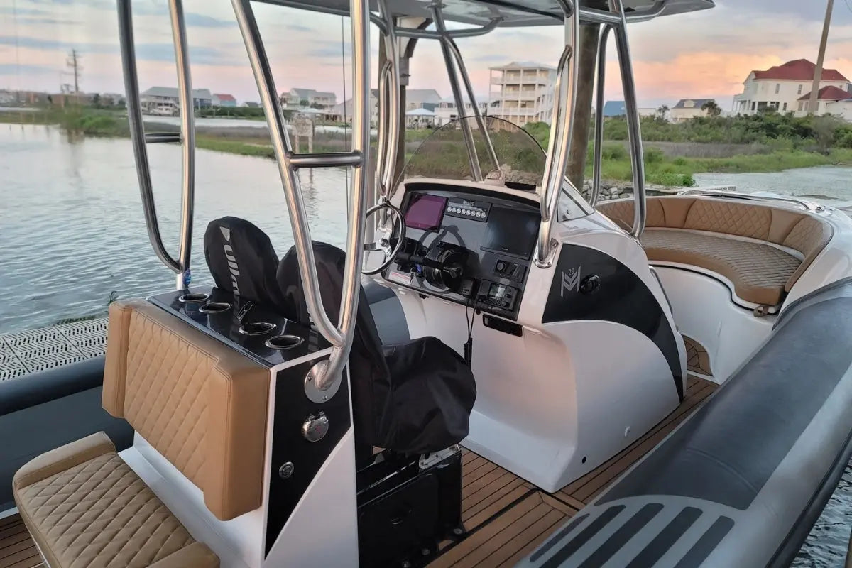 Hyfoil 28 Electric Boat interior with dashboard and seating area, water and buildings in the background