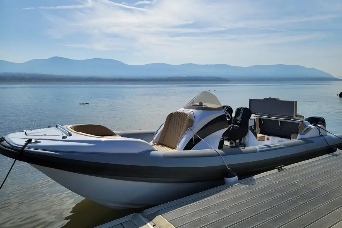 Inflatable Hyfoil 28 Electric Boat on a dock with mountains in the background
