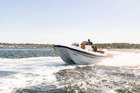 Hyfoil 28 Electric Boat on a body of water with a clear sky