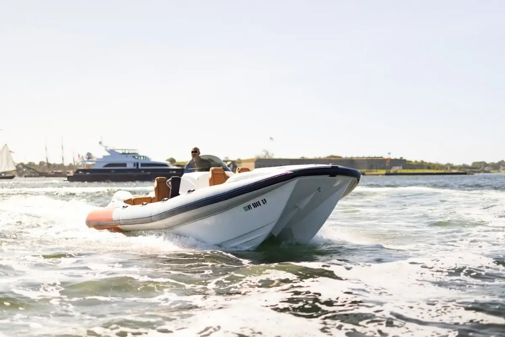 Hyfoil 28 Electric Boat on water with a clear sky background