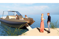 People standing near Hyfoil 32 Electric Boat on a sandy shore with water in the background