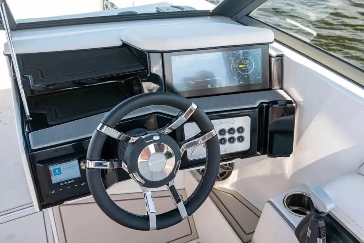 Ingenity 23e Electric Boat steering wheel and dashboard with digital displays on a water background