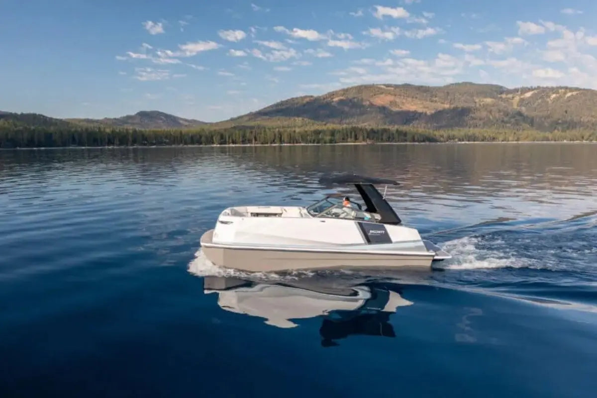 Ingenity 23e Electric Boat on a lake with mountains in the background