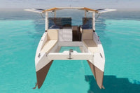 Modern Millikan M9 Electric Boat, clear blue water with a clear sky