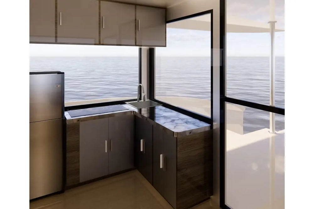 Modern Nova Luxe Eight 40 Electric Boat kitchen with stainless steel appliances and marble countertops.