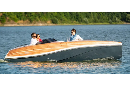Wooden Nova Luxe Faro Electric Boat on a lake with people on board