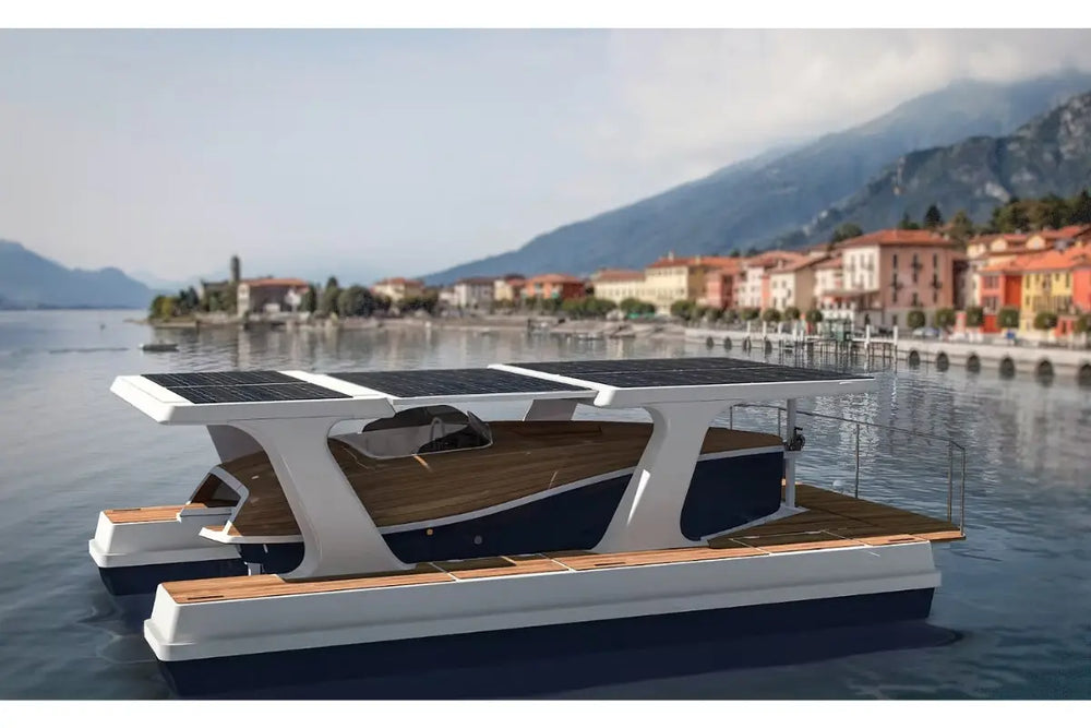 Modern Nova Luxe Faro Electric Boat with solar panels on a lake with mountains and buildings in the background