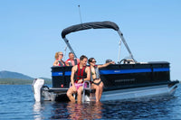People on Princecraft BrioE 19 Electric Boat on a lake with clear blue sky