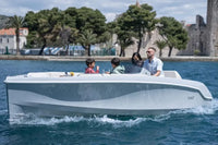 Family on a Rand Breeze 20 Electric Boat with a scenic background