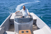 Man on Rand Breeze 20 Electric Boat with a hot tub, enjoying the water.