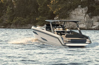 Rand Realm 44 Electric Boat on a body of water with a scenic background