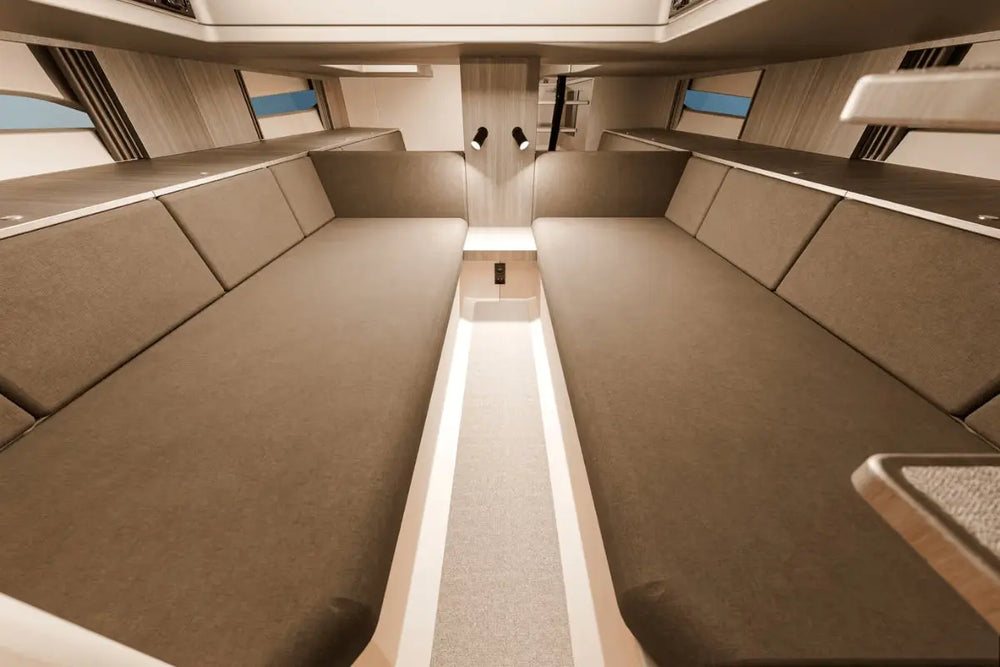 Interior of Rand Realm 44 Electric Boat with brown upholstered seats and a central console.