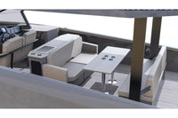 Interior of a modern Rand Solara 33 Electric Boat with seating area and table