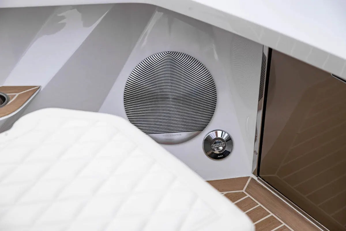 Close-up of Rand Spirit 25 Electric Boat interior with a speaker and control panel.