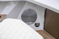 Close-up of Rand Spirit 25 Electric Boat interior with a speaker and control panel.