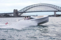 Rand Spirit 25 Electric Boat on water with Sydney Harbour Bridge in the background