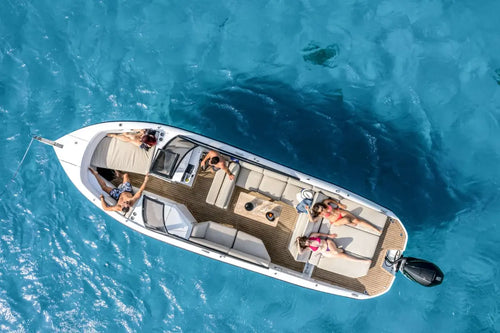 Aerial view of Rand Supreme 27 Electric Boat with people on a clear blue water surface