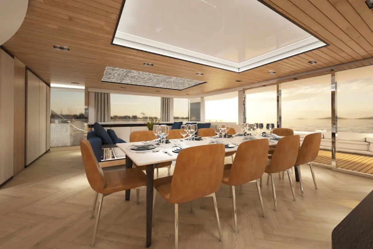 Silent 120 Explorer Electric Boat dining area with wooden chairs and a large table in a stylish interior setting.