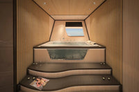 Modern Silent 120 Explorer Electric Boat hot tub with wooden interior and steps leading up to it.