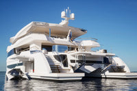 White luxury Silent 120 Explorer Electric Boat on calm water with clear blue sky