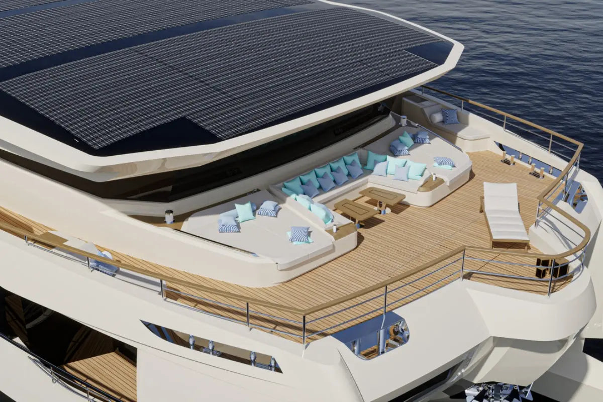 Modern Silent 120 Explorer Electric Boat with solar panels on the roof, deck area with seating, and ocean in the background.